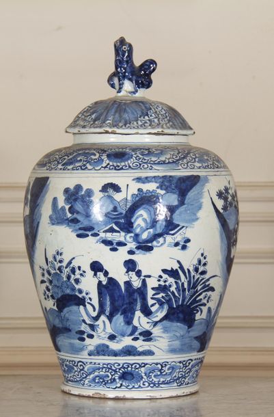 null DELFT XIXth c.
Blue-white earthenware covered baluster vase with Chinese decoration
H...