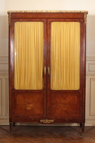 null Veneered wood display case inlaid with flower baskets opening with two doors,...