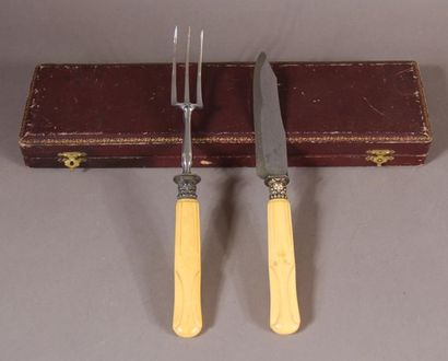 null Eighteen table knives and a carving set, carved ivory handles, silver plated...