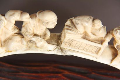 null Okimono in ivory, representing characters accompanied by tengu birds. 
Japan,...