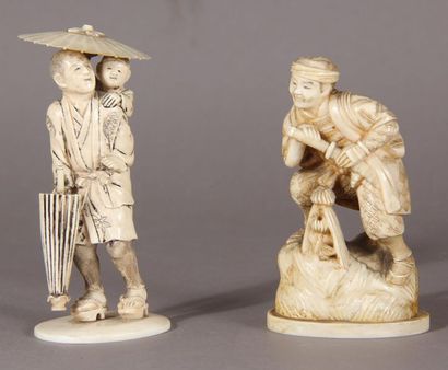 null Two ivory okimono, one representing a peasant holding a sword, the other representing...
