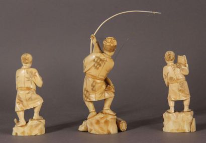 null Lot comprising two ivory okimono, one representing a figure wearing a bow, the...