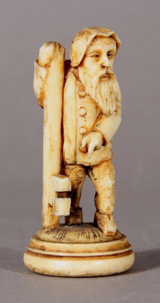 null Sculpture in ivory representing a bearded
character holding a key on which he...