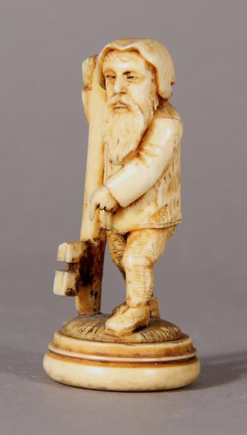 null Sculpture in ivory representing a bearded
character holding a key on which he...
