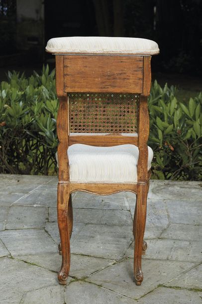 null Moulded and carved caned beech bridge chair with cartouches and flowers decoration....