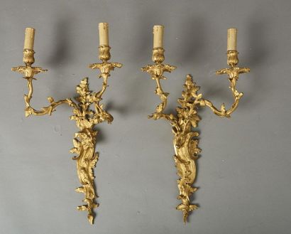 null Pair of deer and wild boar sconces with two light arms, the base plate decorated...