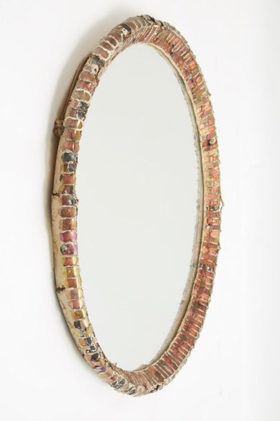 null *Line VAUTRIN (1913-1997
)Ovalized mirror in talosel and surrounded by small...