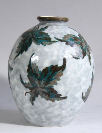 null *Camille THARAUD (1878-1956) Porcelain baluster
vase with green foliage decoration...