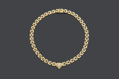 null NECKLACE in yellow gold (750‰), with a bridge mesh, holding a heart-cut diamond...
