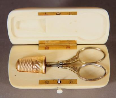 null Sewing kit in an ivory imitation resin case comprising n metal chisel and a...