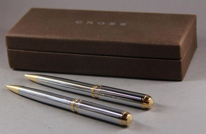 null CROSS
A ballpoint pen and a chrome and gold metal criterium, signed
In their...