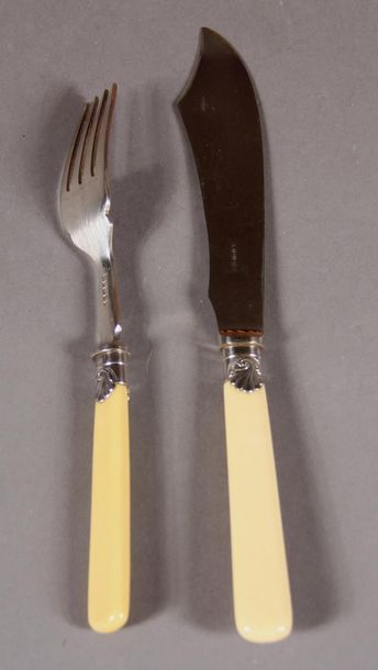 null Twelve fish cutlery in silver plated metal, ivory handles, English work in its...