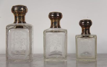 null Three crystal flasks engraved with border and foliage, caps and mount in 950°/°°...