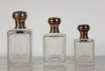 null Three crystal flasks engraved with border and foliage, caps and mount in 950°/°°...