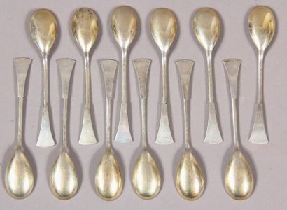 null Twelve dessert spoons in silver 800°/°° and vermeil with flared spatula, foreign...