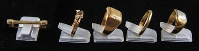 null Lot of 18k gold jewelry:
- Two signet rings, pds: 9.4-5.7 g. 
 - One wedding...