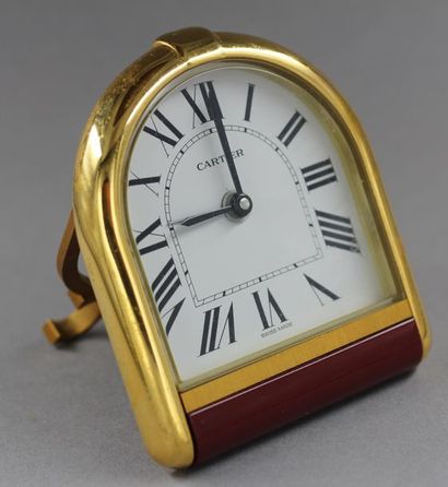 null CARTIER
Romanesque style alarm clock in gold plated metal and brown lacquer....