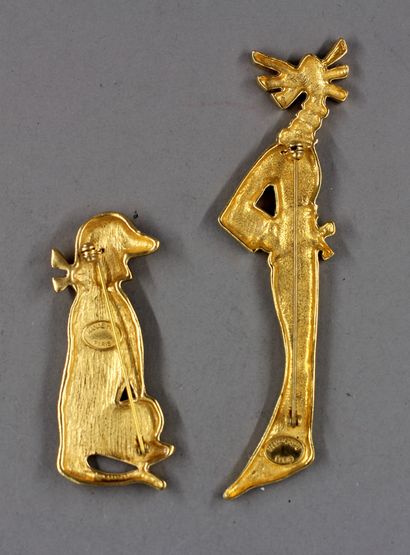 null Hanaé MORI

Deux broches en métal doré en forme de chien et femme debout