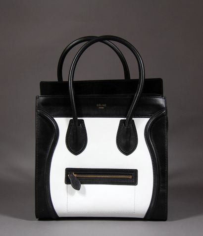 null CELINE Paris

Sac modèle Luggage en veau noir et blanc, double poignée, poche...