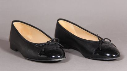 null 
*CHANEL designer Karl LAGERFELD




Pair of black leather ballerinas, patent...