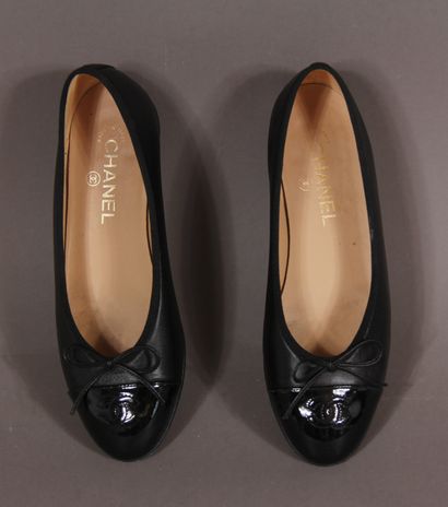null 
*CHANEL designer Karl LAGERFELD




Pair of black leather ballerinas, patent...