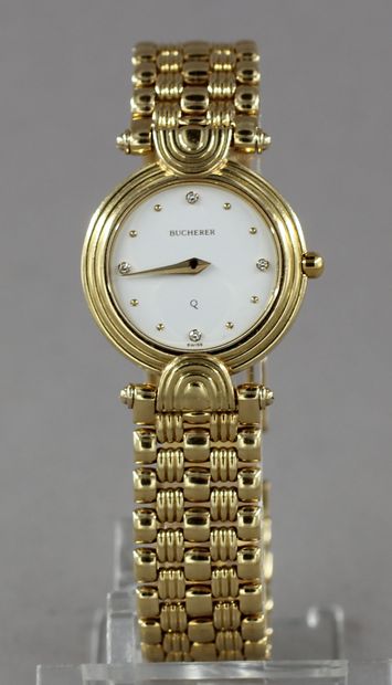 null BUCHERER

Ladies' wristwatch in 18k yellow gold, cream-coloured dial, hour-markers...