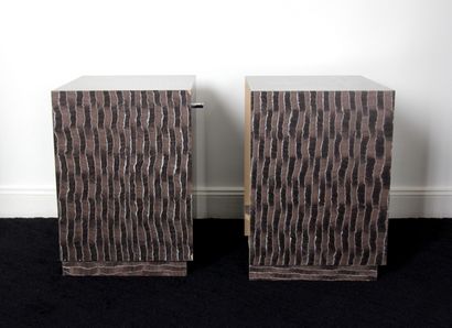 null Pair of cubic bedside tables on a recessed laminate plinth with trompe l'oeil...