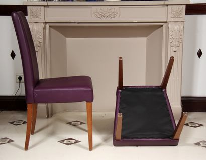 null Pair of high-backed chairs and a pouffe in mauve grained skai, tapered and sabre-shaped...