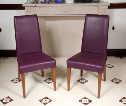 null Four high-backed chairs and a pouffe in mauve grained skai, tapered and sabre-shaped...