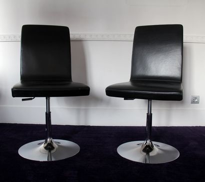 null Three swivel chairs with variable height in black grained leatherette, chrome-plated...