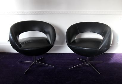 null Five revolving armchairs in black grained leather with openwork back, cruciform...