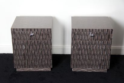 null Pair of cubic bedside tables on a recessed laminate plinth with trompe l'oeil...