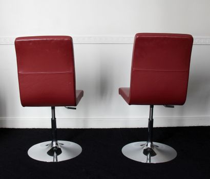 null Three swivel chairs with variable height in red grained leatherette, tulip-shaped...