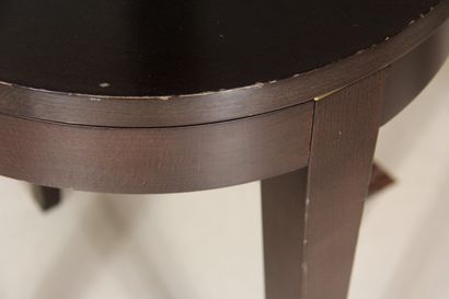 null Pair of round pedestal tables in stained wood, the top resting on gilded metal...