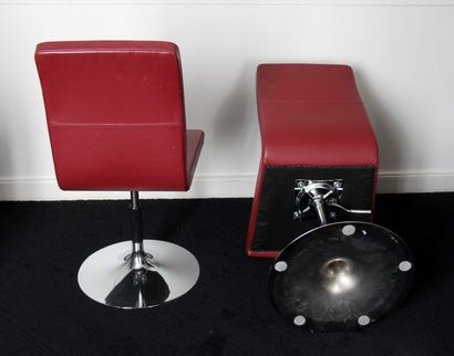 null Three swivel chairs with variable height in red grained leatherette, tulip-shaped...