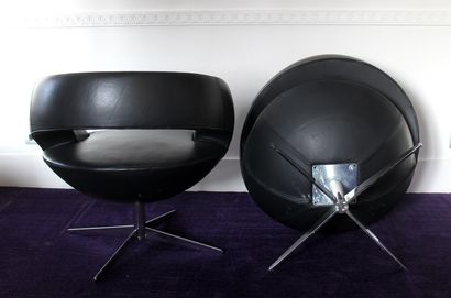 null Five revolving armchairs in black grained leather with openwork back, cruciform...