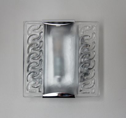 null Three chromed metal cubic sconces with a moulded glass plate decorated in relief...