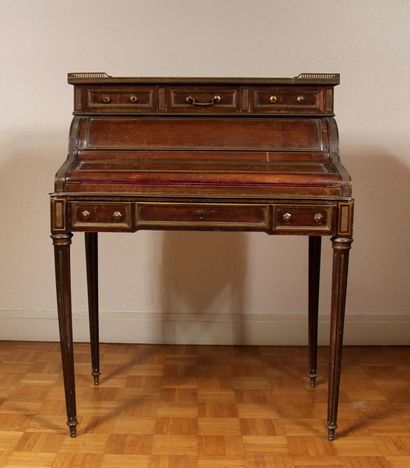 null Mahogany veneered donkey's back desk, marble top with openwork brass gallery,...