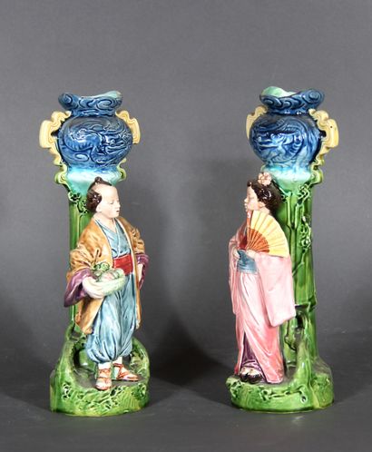 null A pair of polychrome porcelain soliflore vases decorated with Chinese in front...