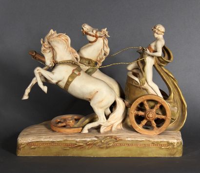 null ROYAL DUX 

The chariot.

Painted biscuit group, marked.

H : 34,5 cm

W : 45...