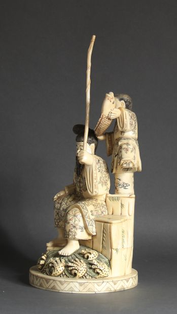 null Bone veneer sculpture representing a fisherman and his son, Japanese style.

H...