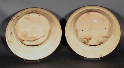 null MUSTERSCHUTZ scenes of the everyday life.

Pair of round bas-relief in polychrome...