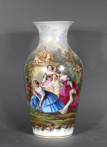 null A porcelain baluster vase with a flared neck with polychrome decoration of young...