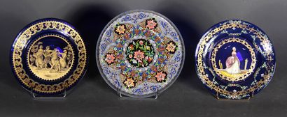 null Two blue transparent glass soup plates with gilded and polychrome decoration...