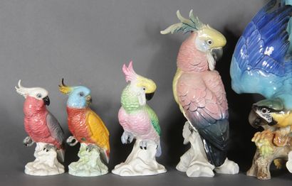 null Set of eight polychrome porcelain statuettes representing parrots and ducks.

H...