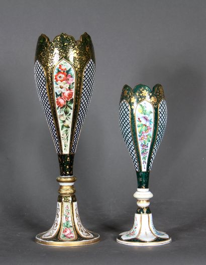 null Two tulip vases on pedestal in transparent green overlay glass decorated with...