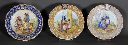 null Set of three round poly-lobed earthenware plates decorated with Breton scenes.

D...