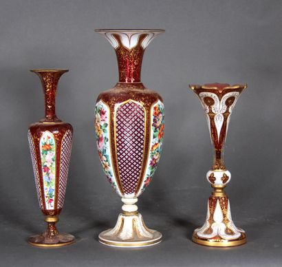 null Two baluster vases and a tulip vase on a pedestal in red transparent overlay...