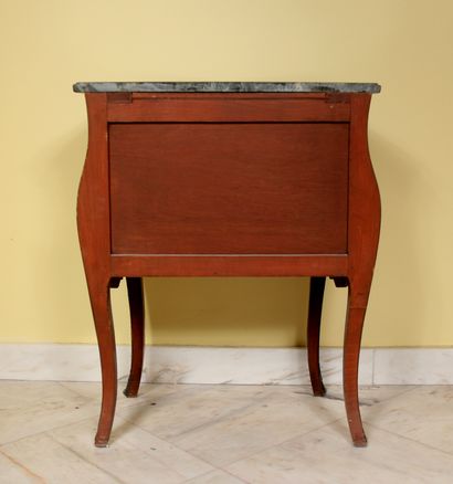 null Curved chest of drawers in veneer with scroll inlays opening to two drawers...