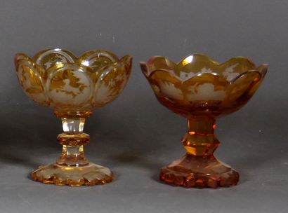null Set of three goblets on feet and two glasses on feet in transparent orange bohemian...